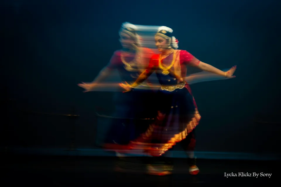 Dancer captured in a flowing turn with intentional motion blur