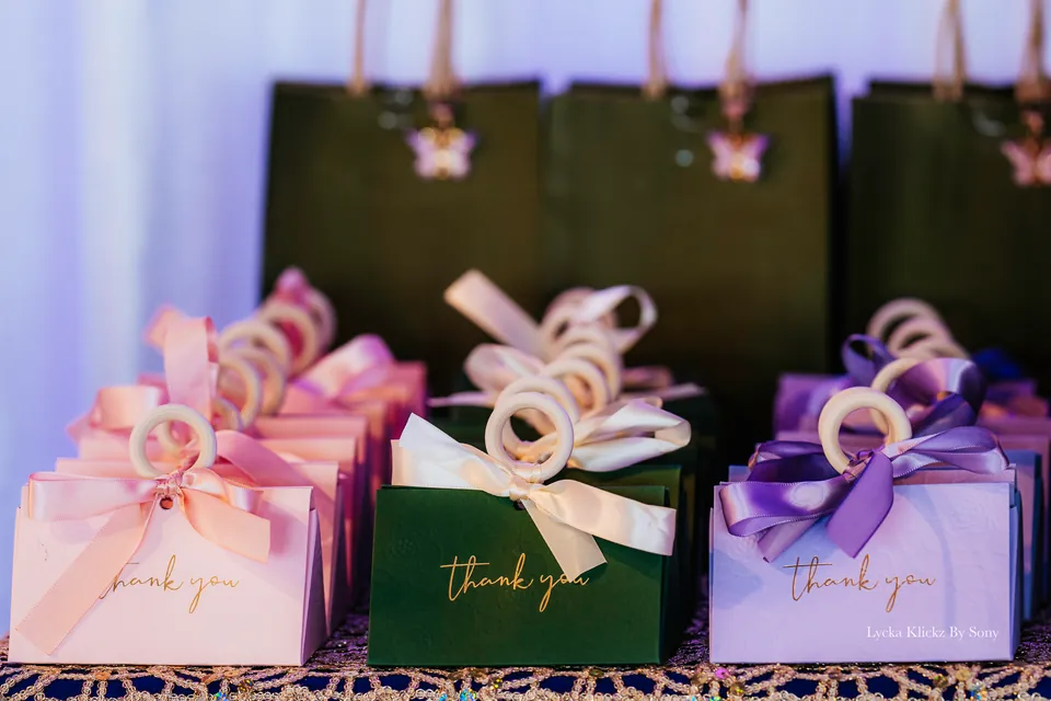 Pastel gift bags tied with ribbons at a wedding celebration
