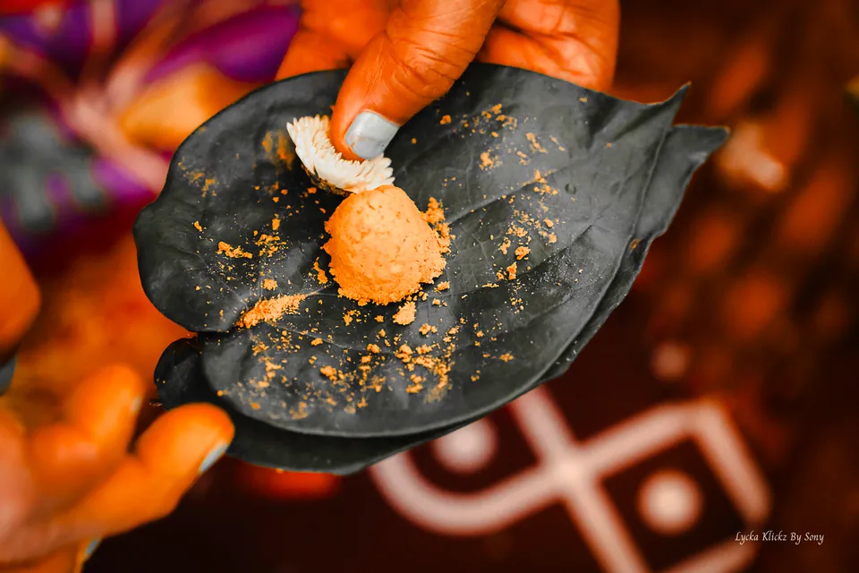 Hands preparing ceremonial ingredients on a leaf