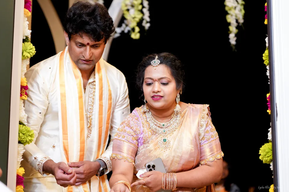Couple standing together during a ceremony in a decorated doorway